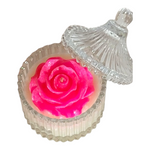 Load image into Gallery viewer, Pink rose-shaped candle in a decorative glass holder with a clear lid on a white background
