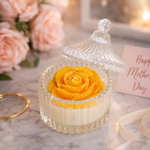 Load image into Gallery viewer, Yellow rose in a glass container with a lid on a marble surface, surrounded by flowers and a 'Happy Mother's Day' card.
