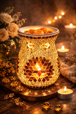 Load image into Gallery viewer, Decorative wax warmer with glowing interior on a wooden surface with candles and flowers.
